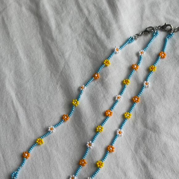 Other Jewelry - Yellow and blue beaded flower
